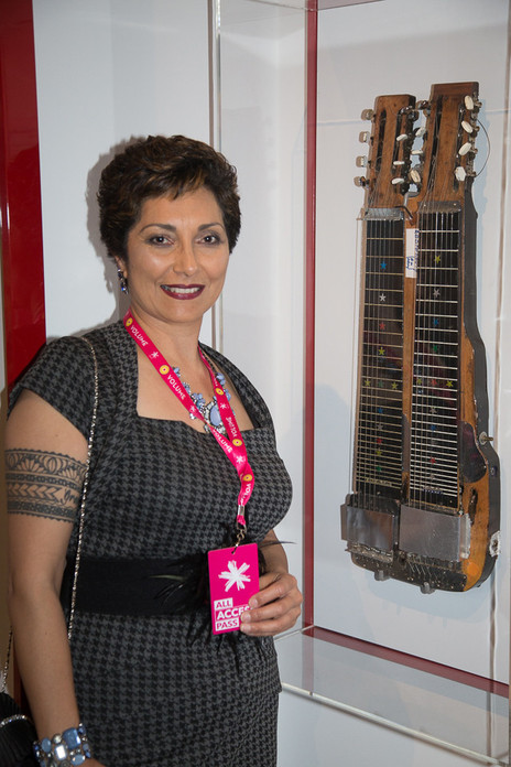 Admin thumb tania jeffs with her father bill sevesi s double neck guitar img 7880c2